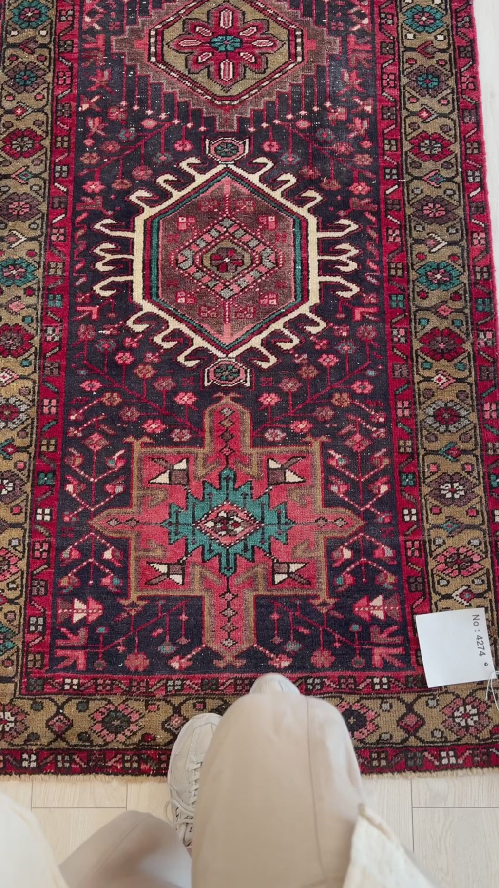 Close-up of Hand-Knotted Vintage Wool Runner Rug – 10' 5" x 3' highlighting detailed tribal patterns and vibrant colors including teal, red, and ivory.