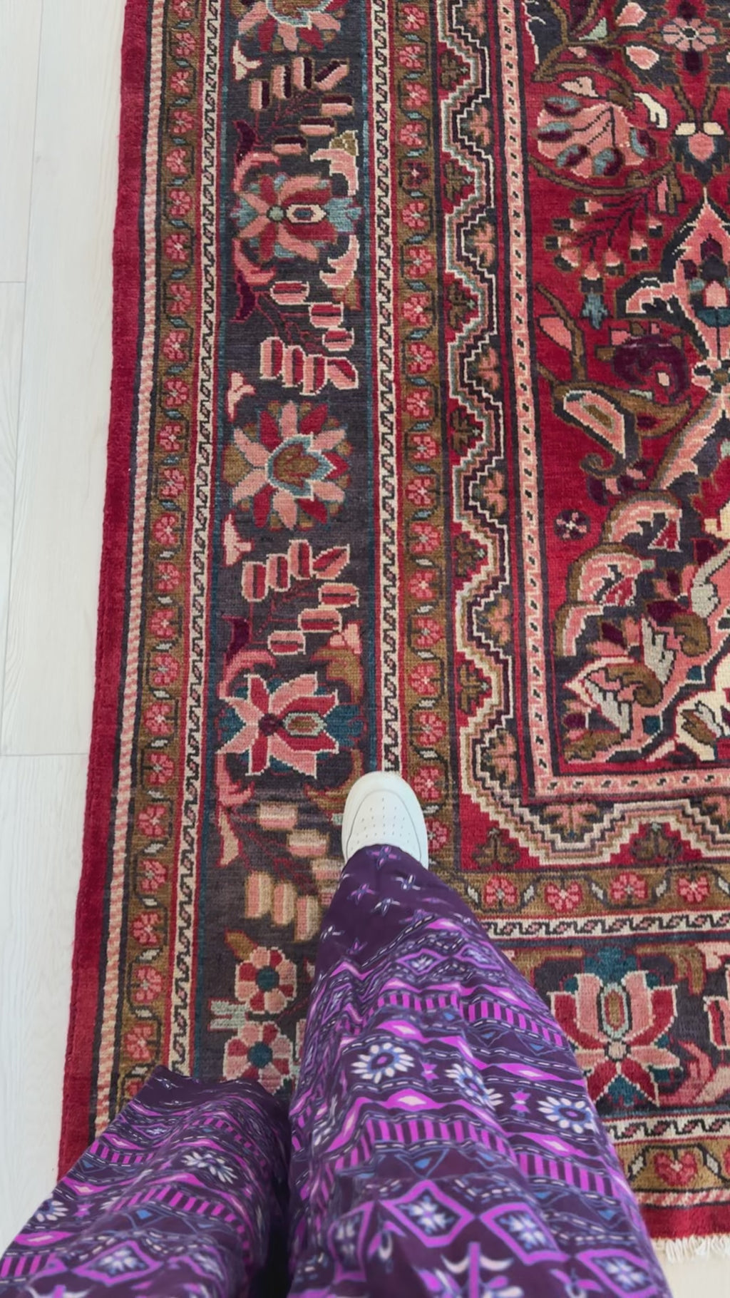 Close-up of border detail on Hand-Knotted Vintage Large Wool Area Rug – 11' 7" x 9' 6" with floral motifs and rich red and navy hues underfoot.