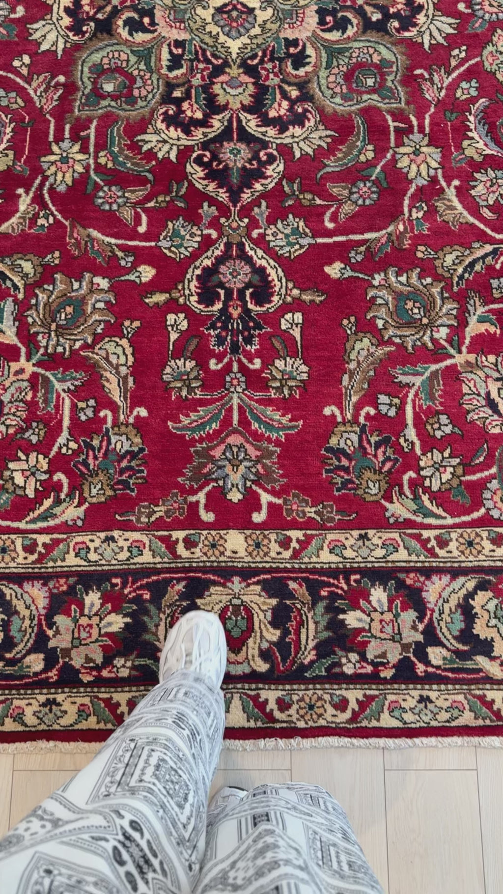 Close-up of Hand-Knotted Vintage Persian 8x10 Red Large Oriental Area Rug showing detailed floral motifs and rich wool texture underfoot.