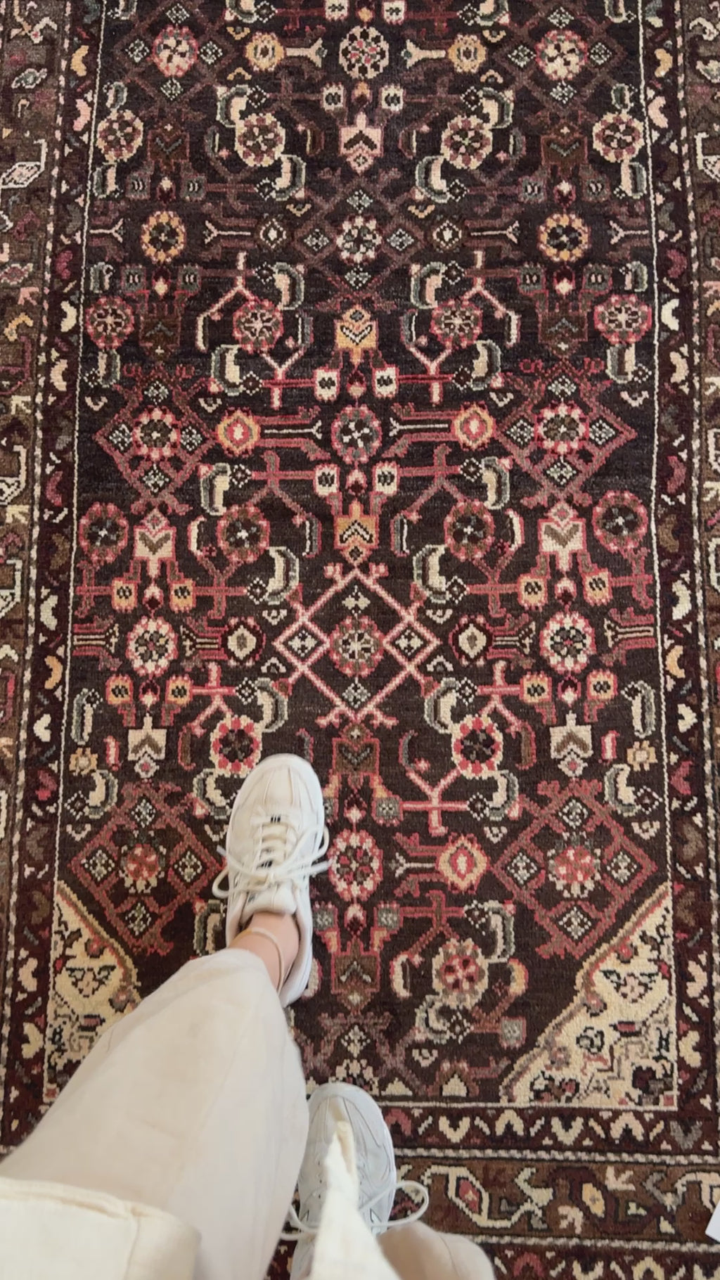 Close-up of Hand-Knotted Vintage Wool Runner Rug – 10' 3" x 3' 7" underfoot, emphasizing rich red and brown tones and symmetrical design.